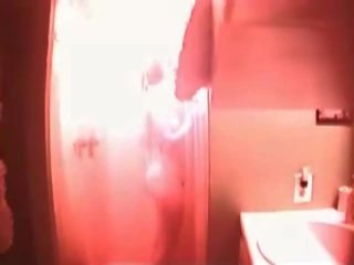 Hot busty teen caught in the shower on hidden cam