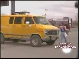 Gas station attendant takes of her shirt