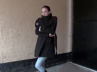 Horny girl pisses in leggings and shows her tits in public